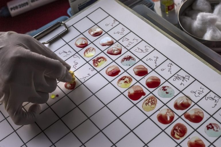 A health official puts blood samples on a blood type grouping test chart during World Blood Donor Day 2014 in Kuala Lumpur, Malaysia, 14 June 2014. Only 2.5 percent of the Malaysian population are regular blood donors compared to five to ten percent in other countries in the world.