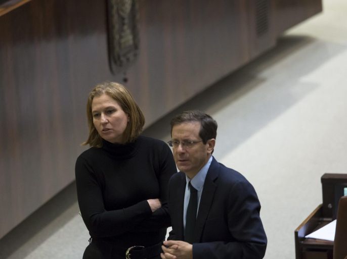 Tzipi Livni (L), the Justice Minister just fired by Israeli Prime Minister Benjamin Netanyahu, confers with Labor party leader Isaac Herzog (R), during voting to dissolve the government in the Knesset (Parliament) in Jerusalem, Israel, 03 December 2014. Israeli lawmakers were expected to vote on a bill dispersing parliament and setting 17 March 2015 as the date for early elections after Prime Minister Benjamin Netanyahu's coalition government unraveled over disagreement on key policies. Netanyahu said a day earlier he was no longer able to lead his strained coalition just two years after it took office. He fired two centrist ministers opposed to his policies.
