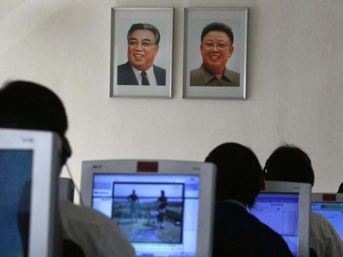 FILE - In this Thursday, Sept. 20, 2012 file photo, North Korean students use computers in a classroom with portraits of the country's later leaders Kim Il Sung, left, and his son Kim Jong Il hanging on the wall at the Kim Chaek University of Technology in Pyongyang, North Korea. Key North Korean websites were back online Tuesday, Dec. 23, 2014 after an hours-long shutdown that followed a U.S. vow to respond to a cyberattack on Sony Pictures that Washington blames on Pyongyang. (AP Photo/Vincent Yu, File)