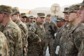 General John Francis Campbell (C), current commander of the International Security Assistance Force and United States Forces in Afghanistan, speaks to soldiers during a Christmas day visit on forward operating base Gamberi in the Laghman province of Afghanistan December 25, 2014. REUTERS/Lucas Jackson (AFGHANISTAN - Tags: CIVIL UNREST POLITICS MILITARY)