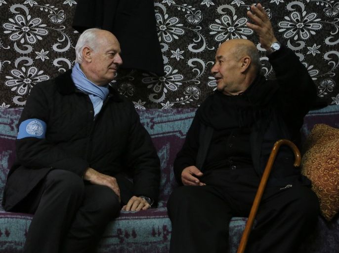 GAZIANTEP, TURKEY - DECEMBER 9: United Nations envoy on the Syrian crisis Staffan de Mistura (L) visits Syrian refugee Mohammed Salih (L2), who fled from Aleppo due to the civil war, after meeting Syrian opponent representatives in Turkey's southeastern Gaziantep on December 9,2014.