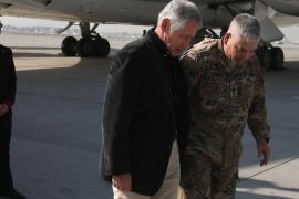 KABUL, AFGHANISTAN - DECEMBER 06: U.S. Secretary of Defense Chuck Hagel is greeted by Gen. John F. Campbell (R) after arriving on December 6, 2013 in Kabul, Afghanistan. Secretary Hagel who resigned last month will stay on the job until his successor former Deputy Secretary of Defense Ashton Carter is confirmed by the US Senate.