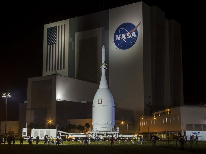 The Orion capsule is moved at Kennedy Space Center in Florida November 11, 2014. The NASA spacecraft designed to one day fly astronauts to Mars rolled out of its processing hangar at the U.S. space agency's Kennedy Space Center in Florida on Thursday to be prepared for a debut test flight in December. REUTERS/Mike Brown (UNITED STATES - Tags: SCIENCE TECHNOLOGY)