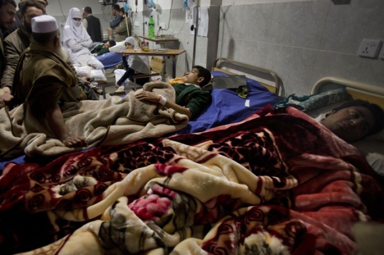 People visit survivors of a Taliban attack on a school at a local hospital in Peshawar, Pakistan, Tuesday, Dec. 16, 2014. Taliban gunmen stormed a military-run school in the northwestern Pakistani city of Peshawar on Tuesday, killing at least 100 people, mostly children, before Pakistani officials declared a military operation to clear the school over. (AP Photo/B.K. Bangash)
