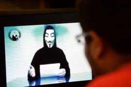A person claiming to speak for activist hacker group Anonymous is seen issuing a warning throught a video circulated online to 'go to war' with the Singapore government over recent Internet licensing rules on November 1, 2013. Activist group Anonymous hacked a Singapore newspaper website on November 1 and threatened wider cyber attacks over Internet freedom, with government agencies reportedly on alert after the group said it would 'wage war' with the city-state. AFP PHOTOROSLAN RAHMAN