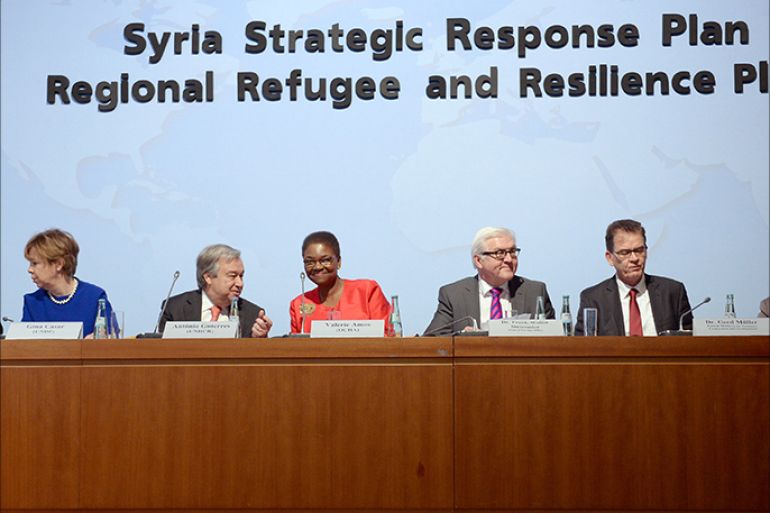 (L-R) Secretary General of the Norwegian Refugee Council (NRC) Jan Egeland, Associate Administrator of the United Nations Development Programme Gina Casar, the United Nations' High Commissioner for Refugees Antonio Guterres, the head of the United Nations Office for the Coordination of Humanitarian Affairs (OCHA) Valerie Amos, German Foreign Minister Frank-Walter Steinmeier, German Minister for Economic Cooperation and Development Gerd Mueller and Patricia Flor of the German Foreign Ministry attend an International conference on Syrian refugees, December 18, 2014 in Berlin. AFP
