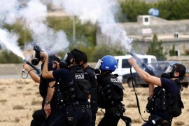 Turkish riot police shoot tear gas to disperse Kurdish protestors during a protest against Islamic State (IS) near Sanliurfa, Turkey, 29 September 2014. In recent days, Turkey has seen the 'biggest influx' of Syrian refugees since the start of the war three years ago, said Selin Unal, a spokeswoman for the UN agency for refugees (UNHCR). The Turkish government figure includes about 140,000 people who fled Kurdish villages in northern Syria to escape an ongoing multi-pronged attack by the Islamic State militant group.