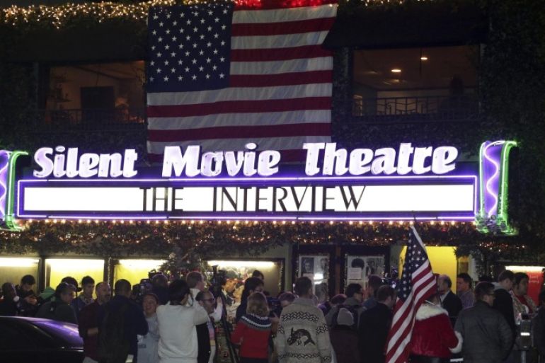 Fans line up at the Silent Movie Theatre for a midnight screening of "The Interview" in Los Angeles, California December 24, 2014. "The Interview," the provocative comedy that triggered a devastating cyber attack on Sony Pictures, went straight to U.S. consumers on Wednesday in an unprecedented online debut on Wednesday. REUTERS/Jonathan Alcorn (UNITED STATES - Tags: POLITICS ENTERTAINMENT)
