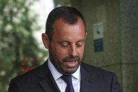 Former president of Barcelona soccer club Sandro Rosell leaves after being questioned at the High Court in Madrid July 22, 2014. The court is investigating alleged misappropriation of funds in last year's signing of Brazilian forward Neymar. REUTERS/Andrea Comas (SPAIN - Tags: SPORT SOCCER CRIME LAW)