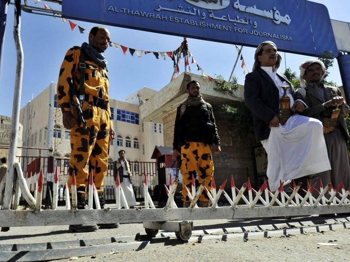 Yemeni soldiers stand guard outside the government-run al-Thawrah newspaper, a day after Shiite Houthi militias stormed it, in Sanaa, Yemen, 17 December 2014. Reports state members of Shiite Houthi militias stormed the Government building allegedly on grounds of corrpution, fiercely denied by the newspaper Union, but despite Government demands to not continue printing, pro-Houthi journalists have allegedly released 17 December's copy without Government or editorial supervision.
