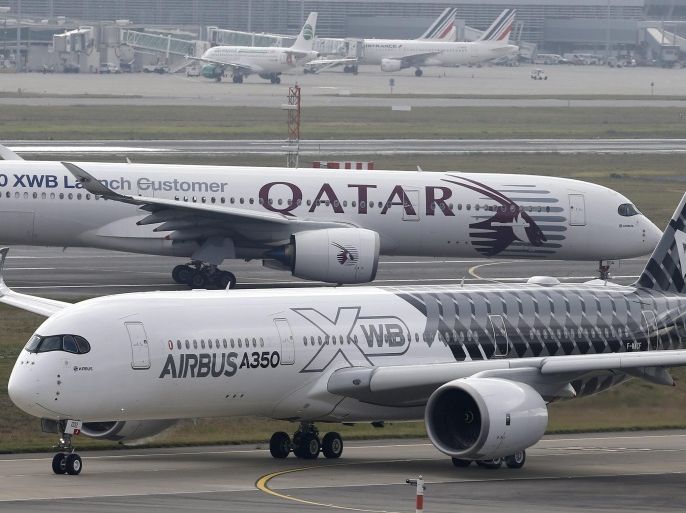 (FILE) An Airbus A350XWB aircraft (front) prepares to take off during a test flight from the Airbus headquarters in Blagnac, Southern France, 29 September 2014. The planned handover of Airbus' first A350 models was postponed indefinitely by buyer Qatar Airways, the European aircraft manufacturer said 10 December 2014. Airbus chief Thomas Enders denied any problems with the new aircraft, despite the cancellation of a scheduled handover ceremony which was planned for 13 December.