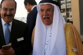 Saudi Oil Minister Ali al-Naimi (R) stands with Bahraini Oil Minister Abdulhussain bin Ali Mirza during the opening session of the 10th Arab Energy Conference in Abu Dhabi, on December 21, 2014. 'Irresponsible' levels of output by producers from outside the OPEC oil cartel is among the main causes of the slump in prices, the United Arab Emirates energy minister told the energy forum. AFP PHOTO/MARWAN NAAMANI