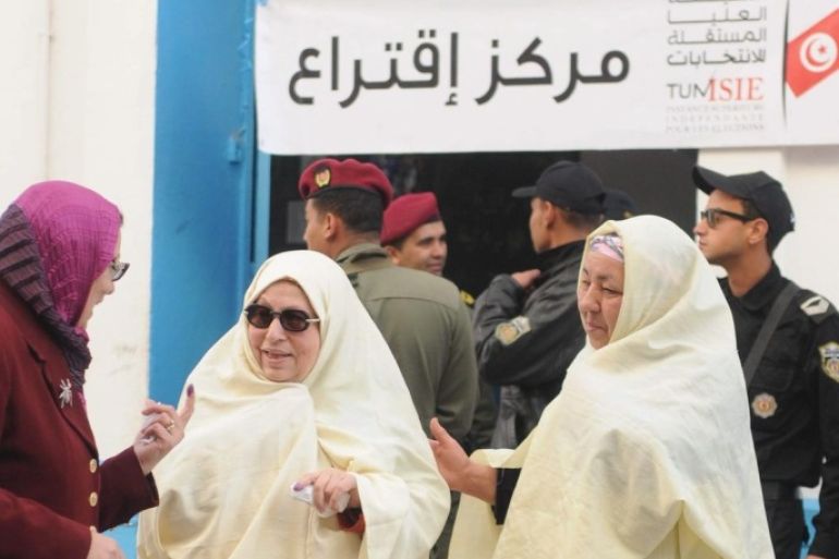 Two elderly women voters leave a polling station in Sousse, Tunisia 21 December 2014 as the country goes to the polls in a presidential run-off election. Official preliminary results are not expected until 22 Decemebr 2014.