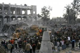 Palestinians inspect the site of an Israeli air strike in the southern town of Rafah on December 27, 2008. At least 120 people were killed across the Gaza Strip as a result of massive Israeli air strikes today, 70 inside Gaza City and the rest elsewhere across the enclave, Hamas radio reported.