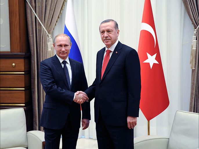 epa04510751 Russian President Vladimir Putin (L) shakes hands with his Turkish counterpart Recep Tayyip Erdogan during their meeting in the new presidential palace outside Ankara, Turkey, 01 December 2014. Putin and Erdogan began a meeting in Ankara to discuss their often opposing views on the crisis in Syria, the Islamic State threat and gas supplies to Turkey. Putin is on a one-day official visit to Turkey. EPA/MIKHAIL KLIMENTYEV / RIA NOVOSTI / KREMLIN POOL