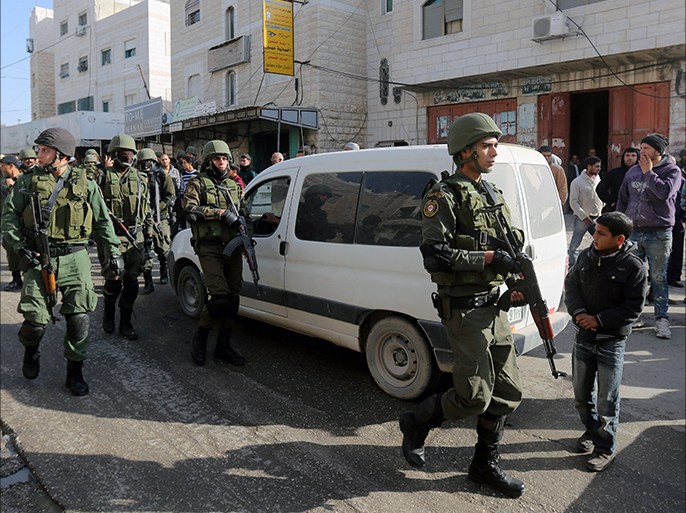 epa04511946 Palestinian police deployed in the Israeli controlled sector of the West Bank city of Hebron, 02 December 2014. Meanwhile, Israel appears headed toward an early election after Prime Minister Benjamin Netanyahu and a key coalition partner failed to bridge differences on the budget and a Jewish nation state proposal, The Jerusalem Post reported. EPA/ABED AL HASHLAMOUN