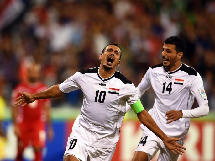 Iraq's Younis Mahmoud (L) celebrates after scoring the 1-0 lead during the AFC Asian Cup Group D soccer match between Iraq and Palestine in Canberra, Australia, 20 January 2015. EPA/PAUL MILLER AUSTRALIA AND NEW ZEALAND OUT