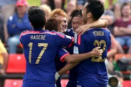NEWCASTLE, AUSTRALIA - JANUARY 12: Japan players celebrate a goal during the 2015 Asian Cup match between Japan and Palestine at Hunter Stadium on January 12, 2015 in Newcastle, Australia.
