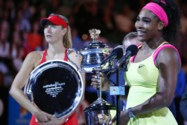 Serena Williams (R) of the US with the Daphne Akhurst Memorial Cup after winning against Maria Sharapova (L) of Russia in their women's finals match at the Australian Open Grand Slam tennis tournament in Melbourne, Australia, 31 January 2015.