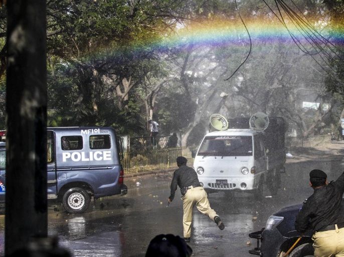 A rainbow appears over the street as Pakistani police use water cannon vehicles to disperse supporters of Islamic political party Jamat-e-Islami during a protest against the French magzine 'Charlie Hebdo' for publishing the caricatures of the prophet Muhammad, in Karachi, Pakistan, 16 January 2015. Thousands of police and paramilitary troops were deployed across Pakistan 16 January ahead of rallies against caricatures of the Muslim prophet Muhammad in French magazine 'Charlie Hebdo', officials said. Several Islamic groups and right-wing political parties called for countrywide protests after Friday prayers to condemn the publication of the images.