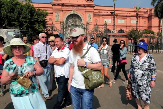 A group of tourists walk outside the Egyptian Museum at Tahrir square in Cairo, Egypt, 20 November 2014. Tourism used to be a major foreign currency earner for Egypt, however the industry was blighted by the political turmoil that gripped Egypt in the wake of the 2011 popular uprising. The situation got worse as violence increased after the army's overthrow of Mohammed Morsi in mid-2013, but in recent months, some countries have cancelled their travel warnings against visiting Egypt.