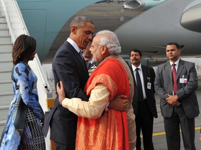 A handout image provided by the Press Information Bureau (PIB) of the Government of India on 25 January 2015 of US President Barack Obama (2-L) and Indian Prime Minister Narendra Modi hugging each other as the US President and First Lady Michelle Obama (L) are greeted on their arrival at Palam airport, New Delhi, 25 January 2015. Others are not identified officials. Obama is in New Delhi for a three-day visit to hold talks with Indian Prime Minister Narendra Modi and attend meetings with US and Indian business leaders. Obama also is the first US president to be a guest of honor at India's annual Republic Day parade, an occasion steeped with symbolism and indicative of a new energy in the relationship between the world's two largest democracies. EPA/PRESS INFORMATION BUREAU/HANDOUT