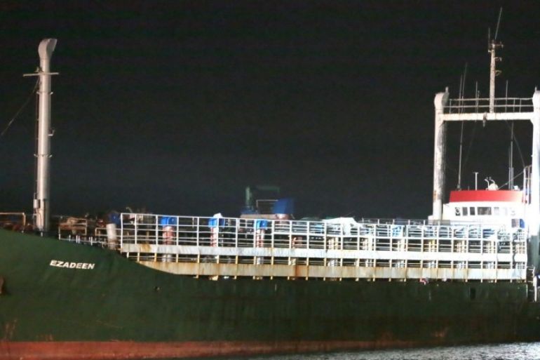 The cargo ship Ezadeen, carrying hundreds of migrants, arrives at the southern Italian port of Corigliano, Italy, late Friday, Jan. 2, 2015. The cargo ship was stopped with about 450 migrants aboard after smugglers sent it speeding toward the coast in rough seas with no one in command. Italian authorities lowered engineers and electricians onto the wave-tossed ship by helicopter to secure it, and the Icelandic Coast Guard towed it to the Italian port of Corigliano late Friday night. Smugglers who bring migrants to Europe by sea appear to have adopted a new, more dangerous tactic: cramming hundreds of them onto a large cargo ship, setting it on an automated course to crash into the coast, and then abandoning the helm. (AP Photo/Antonino D'Urso)