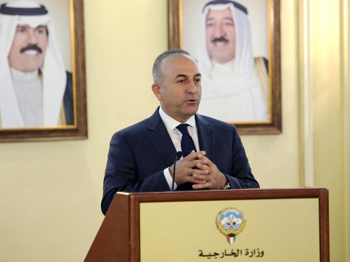 Turkish Foreign Minister Mevlut Cavusoglu holds a press conference with his Kuwaiti counterpart Sheikh Sabah al-Khaled al-Sabah on January 18, 2015 after a meeting at the foreign ministry in Kuwait City. Cavusoglu is on an official visit to the country. AFP PHOTO / YASSER AL-ZAYYAT