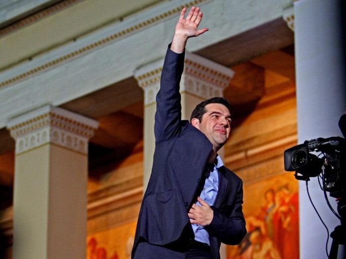 Alexis Tsipras, opposition leader and head of radical leftist Syriza party, greets supporters after the initial election results for the Greece general elections in Athens, Greece, 25 January 2015. Greeks revolted against five years of unrelenting austerity Sunday in a landmark vote that saw the leftist anti-bailout party SYRIZA place first in parliamentary elections. The opposition party was projected to earn around 35 per cent of the vote, falling short of an absolute majority in the 300-seat Parliament by one or two seats, the Interior Ministry said. Thousands of SYRIZA supporters flocked to the Athens University building, chanting and waving the party's red and white flags as party leader Alexis Tsipras addressed the crowd. 'The vote of the Greek people has closed the vicious circle of austerity,' he said, declaring Greece's 240-million-euro (270-million-dollar) bailout now 'a matter of the past.'