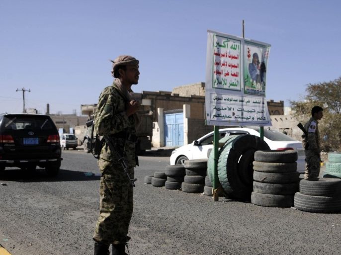 SANA'A, YEMEN - JANUARY 26: Houthi militants worn as Yemeni soldiers' uniform, check the cars at a checkpoint in Sana'a, Yemen on January 26, 2015.