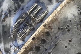 An aerial footage shot by a drone shows the shell craters at the Sergey Prokofiev International Airport damaged by shelling during fighting between pro-Russian separatists and Ukrainian government forces, in Donetsk, eastern Ukraine, seen in this still image taken from a January 15, 2015 handout video by Army.SOS, a Ukrainian group that supports the army by buying ammunition, food and supplies for soldiers. Fighting raged on Saturday at the main airport of Ukraine's city of Donetsk as separatists resumed attempts to break the tenuous grip of government forces on the complex and Kiev's military said three more Ukrainian soldiers had been killed. Image taken January 15, 2015. REUTERS/Army.SOS/Handout via Reuters (UKRAINE - Tags: POLITICS CIVIL UNREST CONFLICT) ATTENTION EDITORS - THIS PICTURE WAS PROVIDED BY A THIRD PARTY. REUTERS IS UNABLE TO INDEPENDENTLY VERIFY THE AUTHENTICITY, CONTENT, LOCATION OR DATE OF THIS IMAGE. FOR EDITORIAL USE ONLY. NOT FOR SALE FOR MARKETING OR ADVERTISING CAMPAIGNS. THIS PICTURE IS DISTRIBUTED EXACTLY AS RECEIVED BY REUTERS, AS A SERVICE TO CLIENTS. NO SALES. NO ARCHIVES