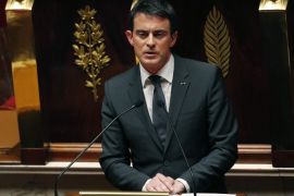 French Prime minister Manuel Valls delivers a speech during a special session of the national assembly to pay tribute to the 17 victims killed in Islamist attacks last week at the French National Assembly in Paris on January 13, 2015. Prime Minister Manuel Valls told members of parliament that France was at 'war with terrorism, jihadism and radicalism', in the wake of the country's bloodiest attacks in half a century. AFP PHOTO / FRANCOIS GUILLOT
