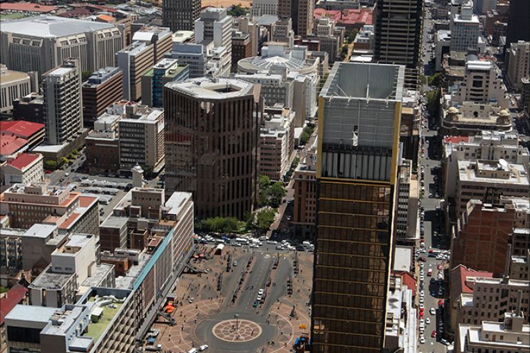 epa02696073 A general view from the 50th floor of the Carton Centre along Main Street with Gandhi Square in the foreground in Johannesburg, South Africa, 25 February 2011. With the advent of democracy in 1994, many large corporations, including the Johannesburg Stock Exchange (JSE), fled downtown Johannesburg for the perceived safety of the northern suburbs, leading to the slow but steady decline of the city centre. But now there is a rejuvenation story happening along city blocks and at specific nodes. EPA