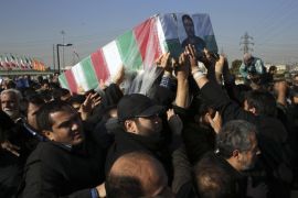 Civilians and armed forces members carry the flag-draped coffin of Iranian Revolutionary Guard Brig. Gen. Mohammad Ali Allahdadi in his funeral ceremony outside the Guard compound in Tehran, Iran, Wednesday, Jan. 21, 2015. Iran's Revolutionary Guard said Wednesday that Israel will be punished for killing Allahdadi in an airstrike in Syria that also killed six Lebanese Hezbollah fighters. (AP Photo/Vahid Salemi)