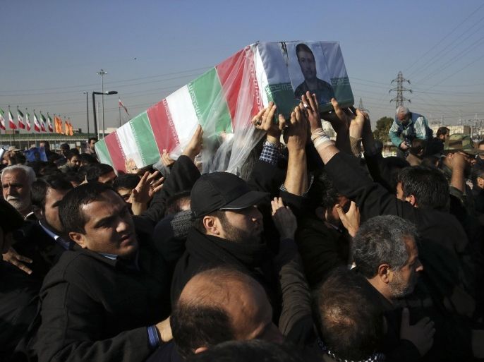 Civilians and armed forces members carry the flag-draped coffin of Iranian Revolutionary Guard Brig. Gen. Mohammad Ali Allahdadi in his funeral ceremony outside the Guard compound in Tehran, Iran, Wednesday, Jan. 21, 2015. Iran's Revolutionary Guard said Wednesday that Israel will be punished for killing Allahdadi in an airstrike in Syria that also killed six Lebanese Hezbollah fighters. (AP Photo/Vahid Salemi)