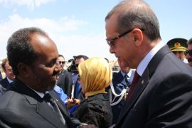 MOGADISHU, SOMALIA - JANUARY 25: Turkish President Recep Tayyip Erdogan (R) is welcomed with an official ceremony by Somalian President Hassan Sheikh Mohamoud (L) at the airport in Mogadishu, Somalia on January 25, 2015.