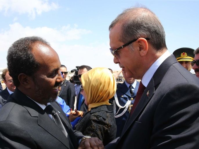 MOGADISHU, SOMALIA - JANUARY 25: Turkish President Recep Tayyip Erdogan (R) is welcomed with an official ceremony by Somalian President Hassan Sheikh Mohamoud (L) at the airport in Mogadishu, Somalia on January 25, 2015.