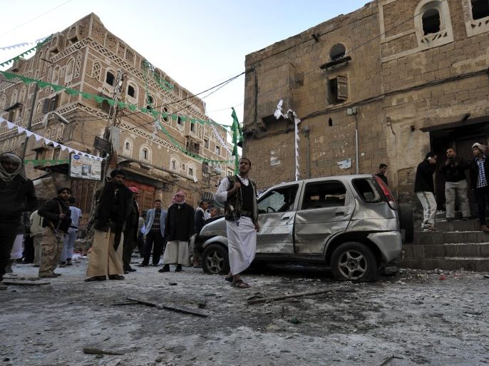 Yemenis gather at the scene of a bomb blast targeting a house of a member of the Shiite Houthi movement, in Sana'a, Yemen, 23 December 2014. Reports state five explosive devices exploded in the houses of members of the Shiite Houthi movement in the old city of Sanaa, killing at least one member of the Shiite militias and wounding three others. Yemeni authorities blamed militants linked to al-Qaeda for the attacks.