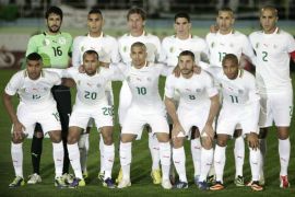 FILE - In this Nov. 19, 2013 file photo, Algeria national soccer team poses prior to the start the World Cup qualifying soccer match between Burkina Faso and Algeria in Blida, Algeria. Background from left: Mohamed Lamine Zemmamouche, Faouzi Ghoulam, Mehdi Mostefa-sbaa, Carl Medjani, Islam Slimani and Madjid Bougherra. Foreground from left: El Arbi Hillel Soudani, Nacereddine Khoualed, Sofiane Feghouli, Medhi Lacen, Yacine Brahimi. ( AP Photo/ Anis Belghoul, File) - SEE FURTHER WORLD CUP CONTENT AT APIMAGES.COM