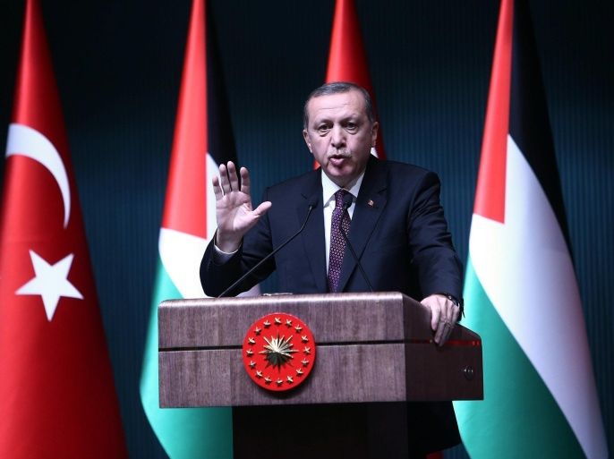 Turkish President Recep Tayyip Erdogan speaks during a press conference with Palestinian President at the presidential palace in Ankara, on January 12, 2015. AFP PHOTO / ADEM ALTAN