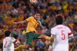 BRISBANE, AUSTRALIA - JANUARY 22: Tim Cahill of Australia heads the ball into the goal during the 2015 Asian Cup match between China PR and the Australian Socceroos at Suncorp Stadium on January 22, 2015 in Brisbane, Australia.