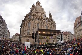Thousands of people take part in a rally themed 'For Dresden, for Saxony - living together in the sense of a global awareness, humanity and dialogue ' on January 10, 2015 in front of the Frauenkirche (Church of Our Lady) in Dresden, eastern Germany. The rally was organised as a response to the anti-Islamic Pegida movement, that plans to rally again on Monday, January 12, 2015. Analysts expect Pegida's ranks to swell by thousands following this week's bloody jihadist violence in France. AFP PHOTO / DPA / ARNO BURGI +++ GERMANY OUT