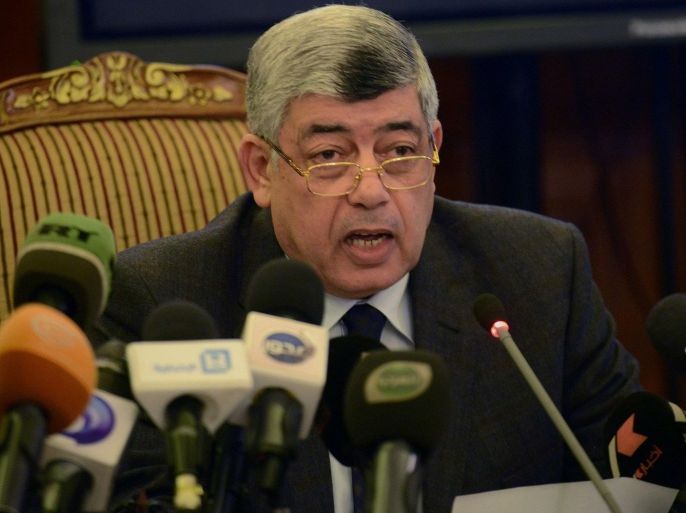 Egypt's Interior Minister Mohamed Ibrahim speaks during a press conference in the capital Cairo on January 26, 2015. Ousted Egyptian president Hosni Mubarak's two sons have been released from prison pending a retrial, Ibrahim said, four years after their arrest following an uprising that toppled their father. AFP PHOTO / MOHAMED EL-SHAHED