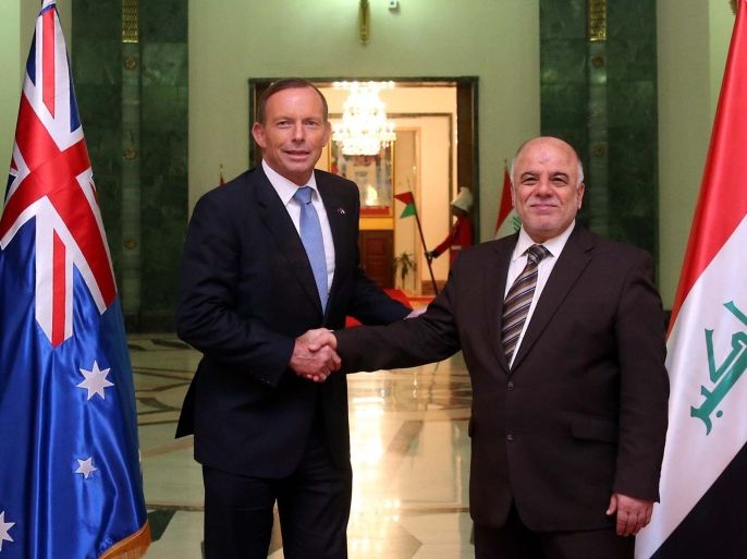 Iraqi Prime Minister Haider al-Abadi (R) shakes hands with Australia's Prime Minister Tony Abbott in Baghdad, January 4, 2015. REUTERS/Iraqi Prime Minister Media Office/Handout via Reuters (IRAQ - Tags: POLITICS) ATTENTION EDITORS - THIS PICTURE WAS PROVIDED BY A THIRD PARTY. REUTERS IS UNABLE TO INDEPENDENTLY VERIFY THE AUTHENTICITY, CONTENT, LOCATION OR DATE OF THIS IMAGE. FOR EDITORIAL USE ONLY. NOT FOR SALE FOR MARKETING OR ADVERTISING CAMPAIGNS. THIS PICTURE IS DISTRIBUTED EXACTLY AS RECEIVED BY REUTERS, AS A SERVICE TO CLIENTS. NO SALES. NO ARCHIVES