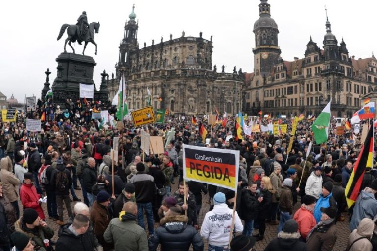 Participants of a rally of the 'Pegida' (Patriotic Europeans against the Islamization of the West) anti-Islam movement gather in Dresden, Germany, 25 January 2015. 'Pegida' moved their rally from Monday, 26 January, to the earlier Sunday, 25 January.