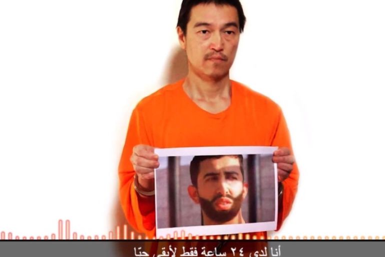 This still image taken from a video posted on YouTube by jihadists on Tuesday, Jan. 27, 2015, shows a still photo of Japanese journalist Kenji Goto holding what appears to be a photo of Jordanian pilot 1st Lt. Mu'ath al-Kaseasbeh. Both are being held hostage by the Islamic State militant group. The still image was overdubbed with audio in which Goto delivers a message from the militants demanding the release of Sajida al-Rishawi, an Iraqi woman sentenced to death in Jordan for involvement in a 2005 terror attack that killed 60 people. The Arabic subtitle reads "I only have 24 hours left to live." The Associated Press could not independently verify the video. (AP Photo)