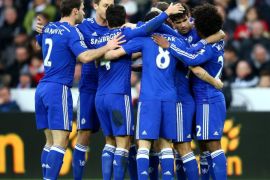 SWANSEA, WALES - JANUARY 17: Diego Costa of Chelsea celebrates with team-mates after scoring his team's second goal during the Barclays Premier League match between Swansea City and Chelsea at Liberty Stadium on January 17, 2015 in Swansea, Wales.