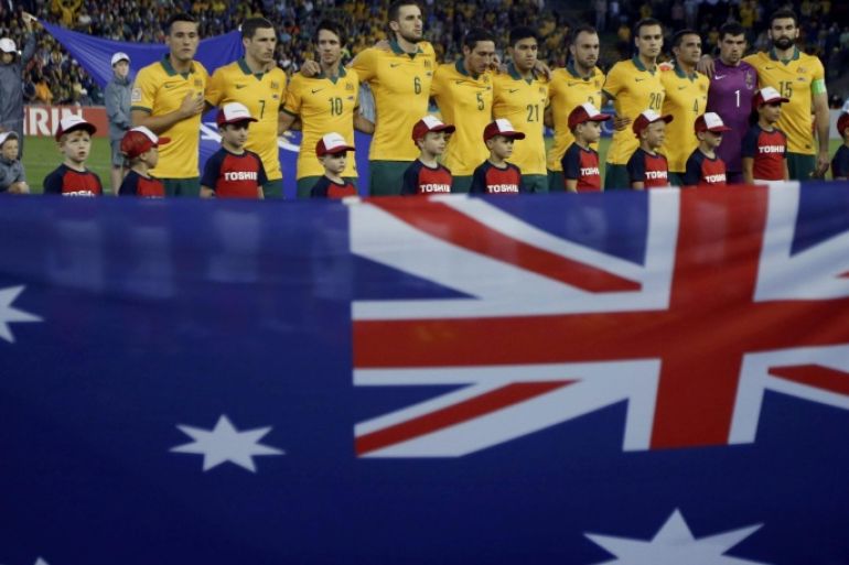 Australia's players line up for their national anthem before the start of their Asian Cup semi-final soccer match against UAE at the Newcastle Stadium in Newcastle January 27, 2015. REUTERS/Jason Reed (AUSTRALIA - Tags: SPORT SOCCER)