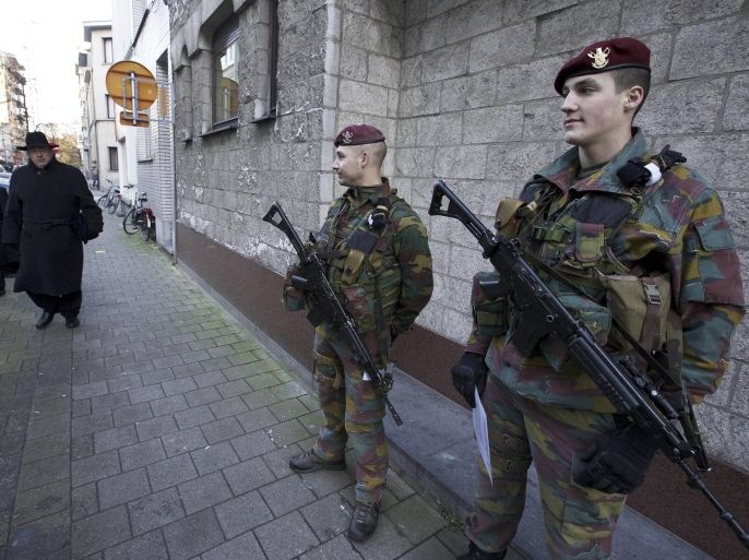 Belgian soldiers patrol in Antwerp on January 17, 2015 after security forces smashed a suspected Islamist 'terrorist' cell planning to kill police officers. Up to 300 soldiers will be progressively deployed in the capital Brussels and the northern city of Antwerp, which has a large Jewish population, Prime Minister Charles Michel's office said in a statement. Security forces early on January 16 killed two suspected Islamists in a huge raid in the eastern city of Verviers on an alleged jihadist cell planning to attack police in the country, and police arrested 13 people during a series of following raids across Belgium. AFP PHOTO / BELGA / NICOLAS MAETERLINCK **Belgium Out**