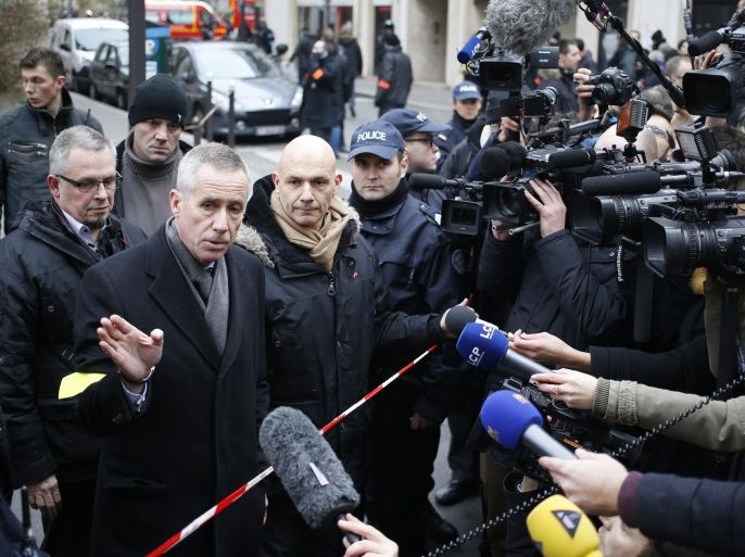 Francois Molins, Paris' prosecutor talks to the press after he arrived at the headquarters of the French satirical newspaper Charlie Hebdo in Paris on January 7, 2015, after armed gunmen stormed the offices leaving eleven dead, including two police officers, according to sources close to the investigation. AFP PHOTO / KENZO TRIBOUILLARD